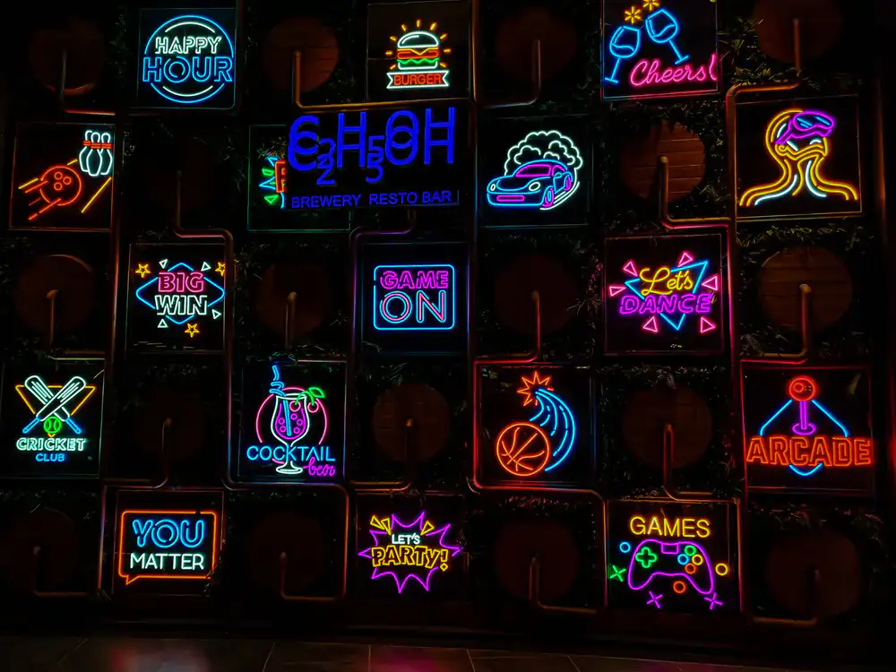 A variety of bar snacks, burgers, and craft drinks on a table