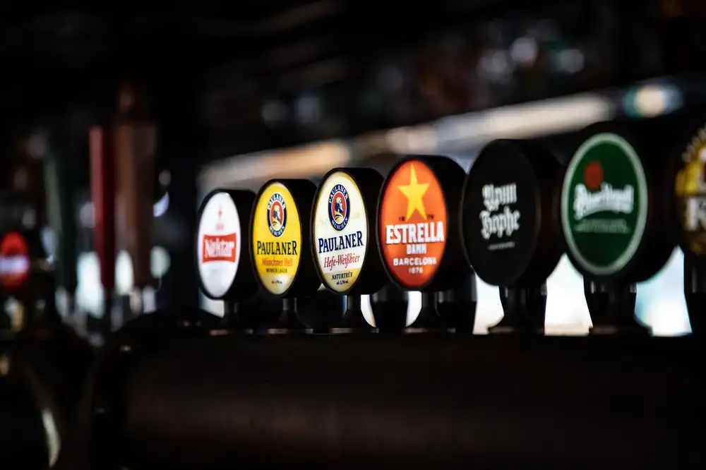 Bartender pouring a craft beer at the lounge