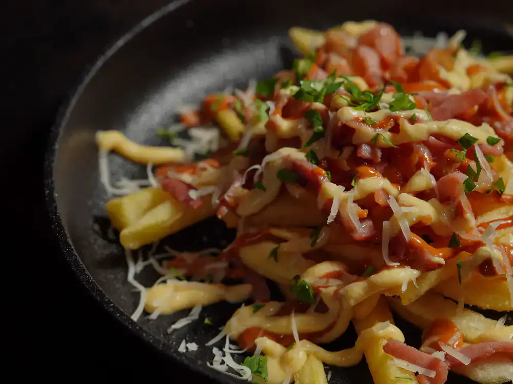 Crispy fries topped with cheese and bacon